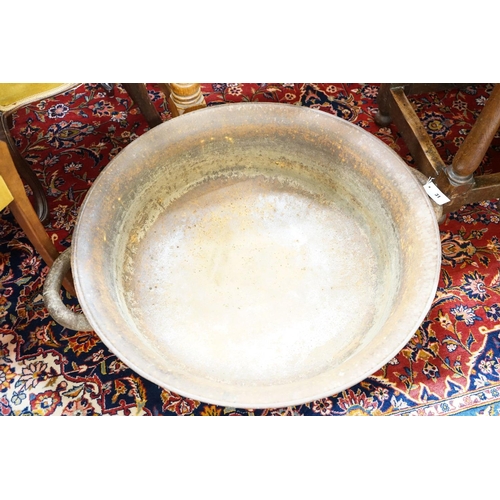 31 - A large cast iron French circular preserve pan, diameter 82cm, height 26cm