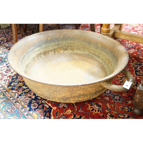 31 - A large cast iron French circular preserve pan, diameter 82cm, height 26cm