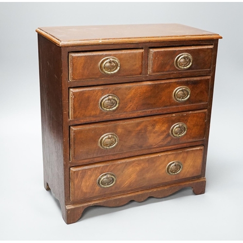 312 - A 19th century mahogany miniature chest of drawers 35cm high, 33cm wide