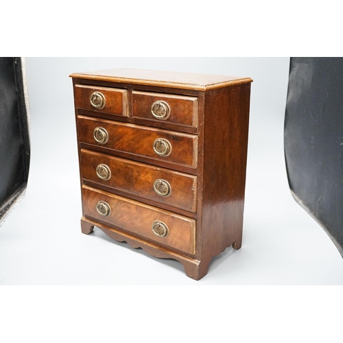 312 - A 19th century mahogany miniature chest of drawers 35cm high, 33cm wide