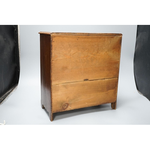 312 - A 19th century mahogany miniature chest of drawers 35cm high, 33cm wide