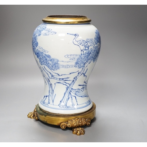 314 - A Chinese blue and white baluster vase, brass mounted 29cm