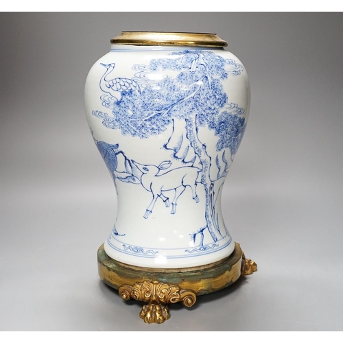 314 - A Chinese blue and white baluster vase, brass mounted 29cm