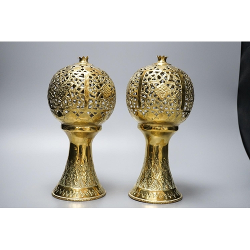 317 - A pair of Indian brass incense burners, each of pomegranate form, 28cm