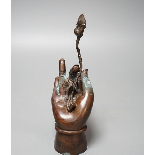 320 - A Himalyan bronze Bodhisattvas hand, holding a lotus flower 22cm