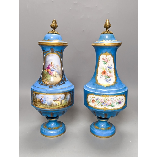 361 - A pair of Sevres style porcelain bleu celeste ground vases and covers, 34cm