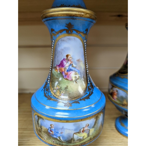 361 - A pair of Sevres style porcelain bleu celeste ground vases and covers, 34cm