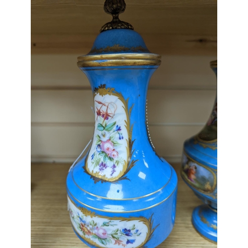 361 - A pair of Sevres style porcelain bleu celeste ground vases and covers, 34cm