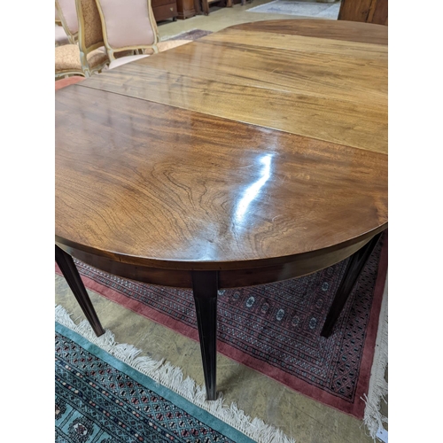 38 - A George III mahogany D end extending dining table, with drop flap central section, length 240cm ext... 