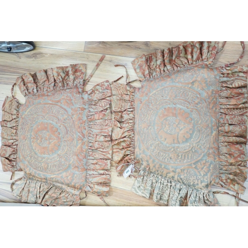 380 - A pair of Fortuni 'Orsini pattern' seat cushions in rust and gold colourway