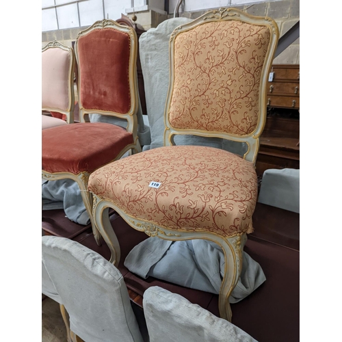 39 - A set of fourteen French Louis XV style painted upholstered dining chairs with loose covers... 