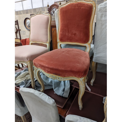 39 - A set of fourteen French Louis XV style painted upholstered dining chairs with loose covers... 