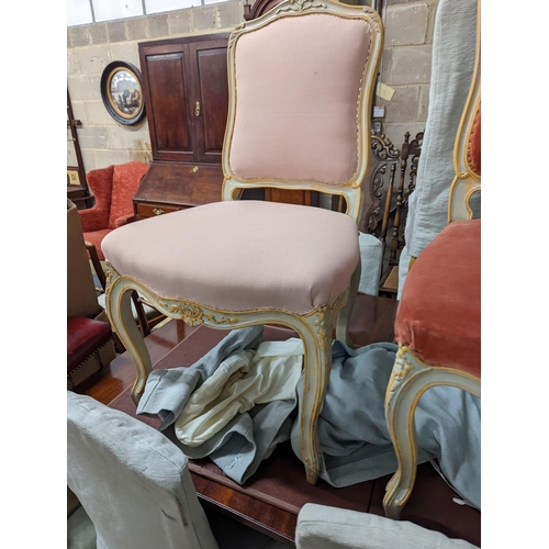 39 - A set of fourteen French Louis XV style painted upholstered dining chairs with loose covers... 