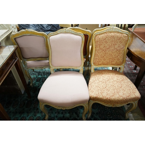 39 - A set of fourteen French Louis XV style painted upholstered dining chairs with loose covers... 