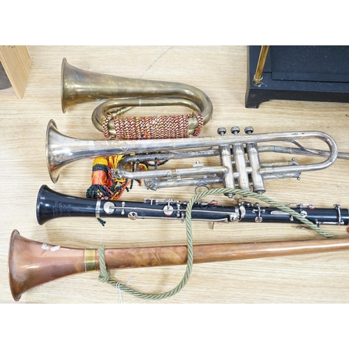 393 - A Boosey and co Clarinet H.75983, plated trumpet, brass bugle and a copper hunting horn 87cm... 