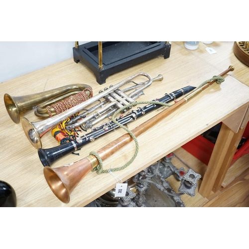 393 - A Boosey and co Clarinet H.75983, plated trumpet, brass bugle and a copper hunting horn 87cm... 