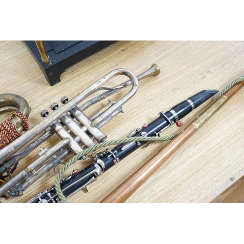 393 - A Boosey and co Clarinet H.75983, plated trumpet, brass bugle and a copper hunting horn 87cm... 