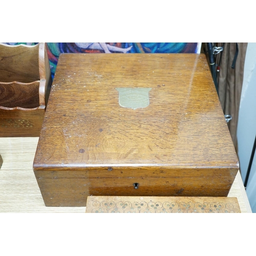 402 - A Georgian square mahogany tea caddy, a brass inlaid hardwood stationary rack and box, and sundry it... 