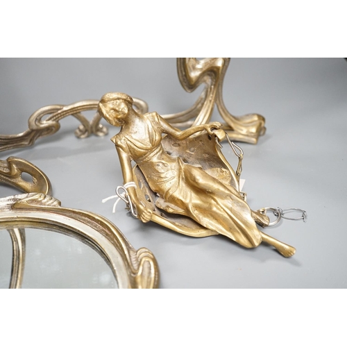 409 - An Art Nouveau style mirror with model of girl sitting on a swing, height 45cm