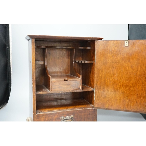 412 - A late Victorian smokers cabinet with embossed metal panel to door and fitted interior 40cm... 