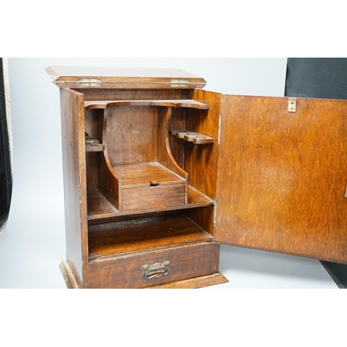 412 - A late Victorian smokers cabinet with embossed metal panel to door and fitted interior 40cm... 