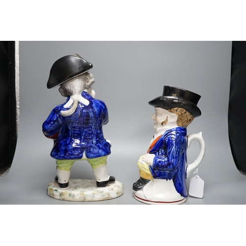 442 - Two Staffordshire Toby jugs and a pair of Kings Charles Spaniel figures