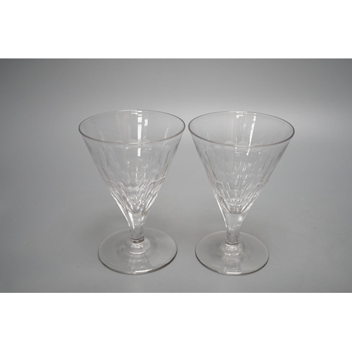 452 - A set of ten facet cut conical wine glasses, 14cm