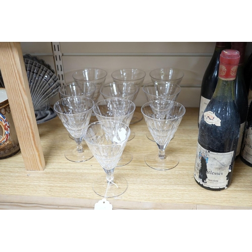 452 - A set of ten facet cut conical wine glasses, 14cm