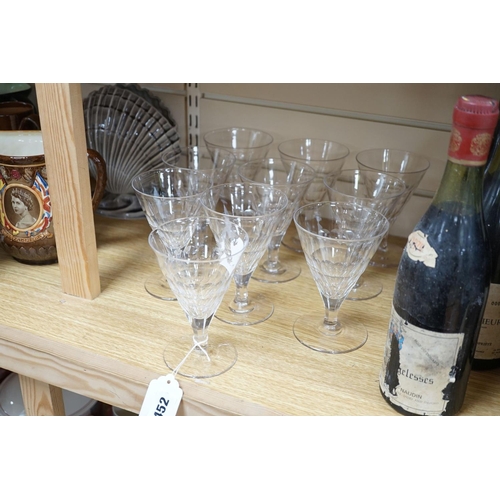 452 - A set of ten facet cut conical wine glasses, 14cm