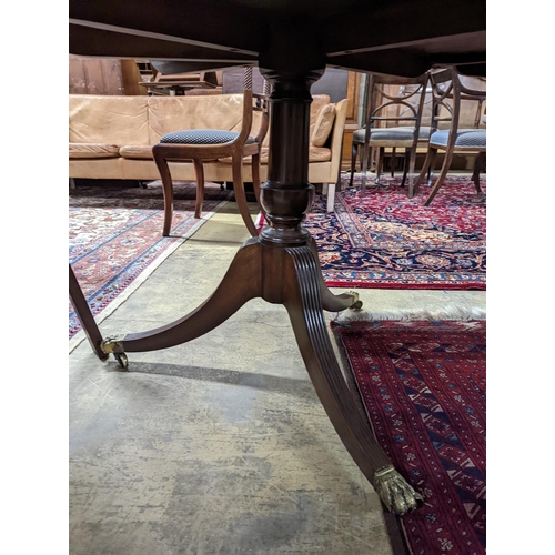 46 - A George III style mahogany twin pillar extending dining table, length 244cm extended, width 106cm, ... 