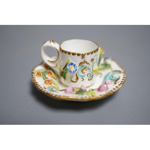 464 - A Coalbrookdale miniature flower encrusted cup and saucer, c.1820. Provenance - Mona Sattin collecti... 