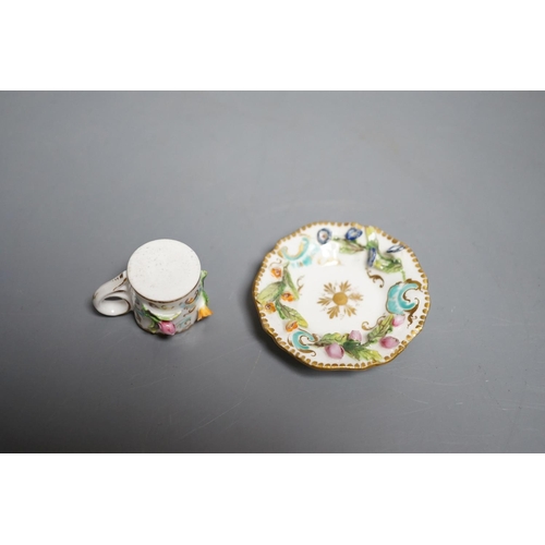 464 - A Coalbrookdale miniature flower encrusted cup and saucer, c.1820. Provenance - Mona Sattin collecti... 