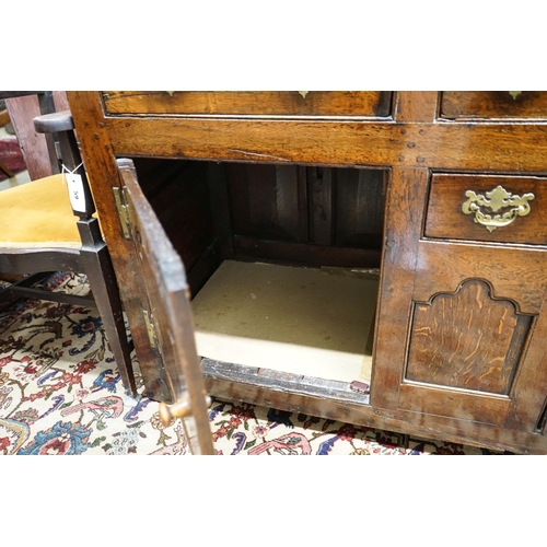 60 - A mid 18th century oak dresser base, length 140cm, depth 55cm, height 88cm