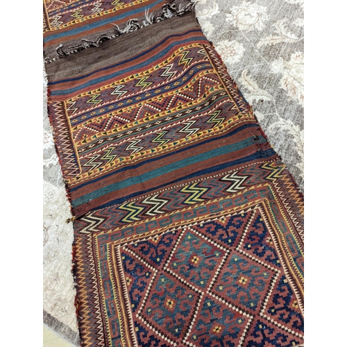 66 - An Afghan Kelim bag/wall hanging, 280 x 78cm