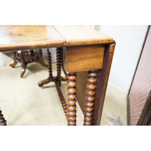 7 - A Victorian figured walnut Sutherland table on bobbin turned under frame, length 120cm extended, wid... 