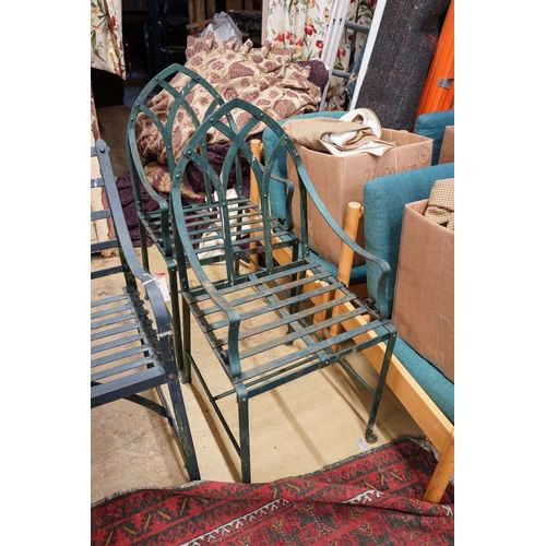 76 - A green painted wrought iron garden bench, length 186cm, depth 46cm, height 92cm together with two G... 