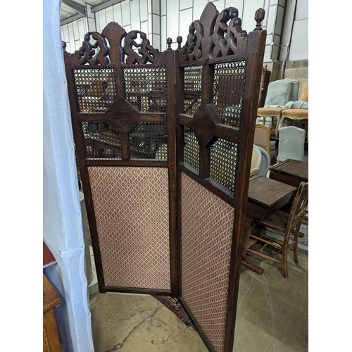 8 - A 1920's Carolean style oak and cane work two fold dressing screen, each panel width 60cm, height 18... 