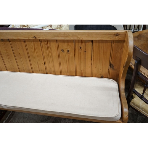 82 - A Victorian style pitch pine pew with cushion seat, length 187cm, depth 40cm, height 88cm... 