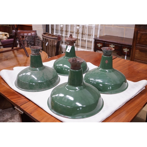 88 - A set of four industrial style green enamelled ceiling shades, diameter 36cm