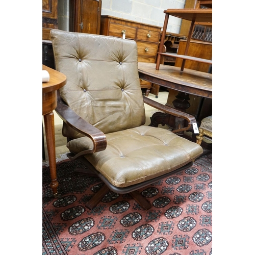 89 - A mid century swivel chair with leather cushion upholstery, width 77cm, depth 75cm, height 94cm... 