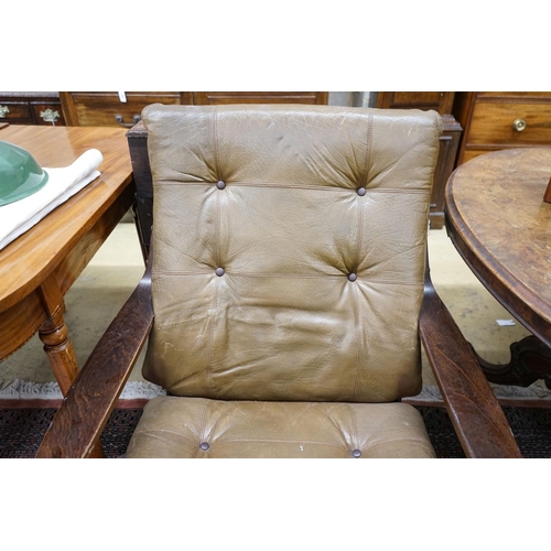 89 - A mid century swivel chair with leather cushion upholstery, width 77cm, depth 75cm, height 94cm... 