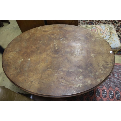 91 - A Victorian oval figured walnut tilt top loo table, width 135cm, depth 100cm, height 72cm... 