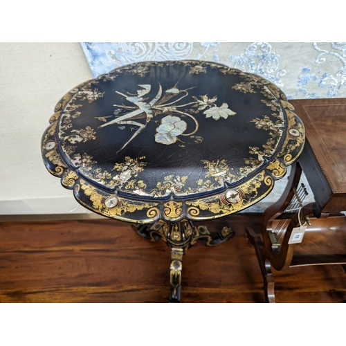 10 - A Victorian mother of pearl inlaid gilt decorated circular  tilt top papier mache tripod wine table,... 