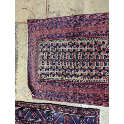 100 - A Bokhara red ground rug and a Belouch prayer rug, larger 144 x 88cm