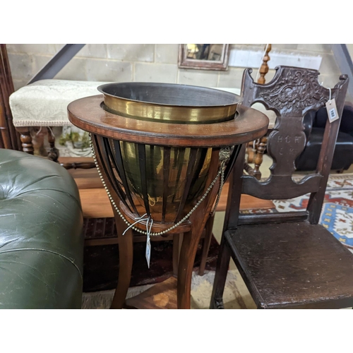 101 - An Edwardian inlaid mahogany jardiniere with associated brass liner, height 92cm