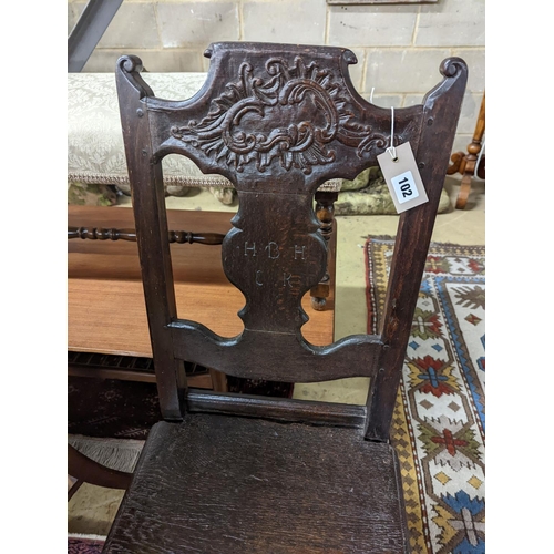 102 - A 17th century style Continental oak back stool, width 40cm, depth 34cm, height 102cm