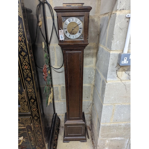 125 - A 1920's oak cased grandmother clock, height 143cm