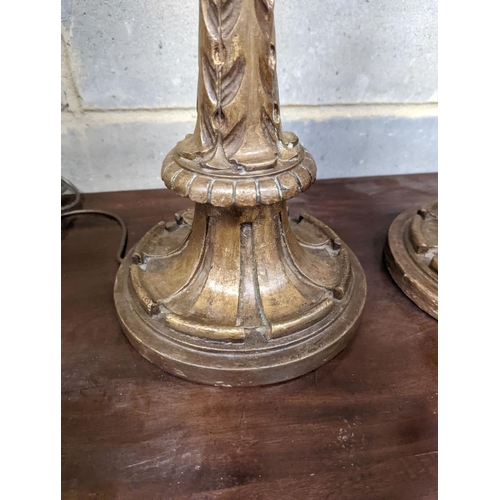 128 - A pair of 1920's Italian gilt wood painted carved table lamps, height 60cm