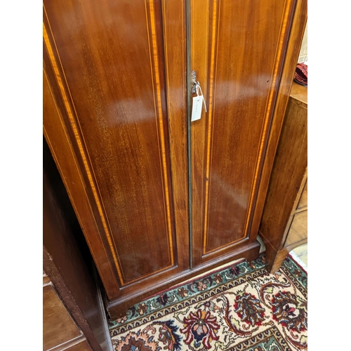 137 - A Edwardian satinwood banded mahogany two door bookcase, width 83cm, depth 31cm, height 198cm... 