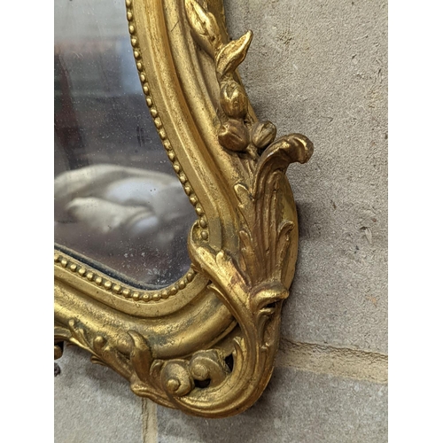 138 - A 19th century French giltwood and gesso cartouche wall mirror, width 51cm, height 66cm